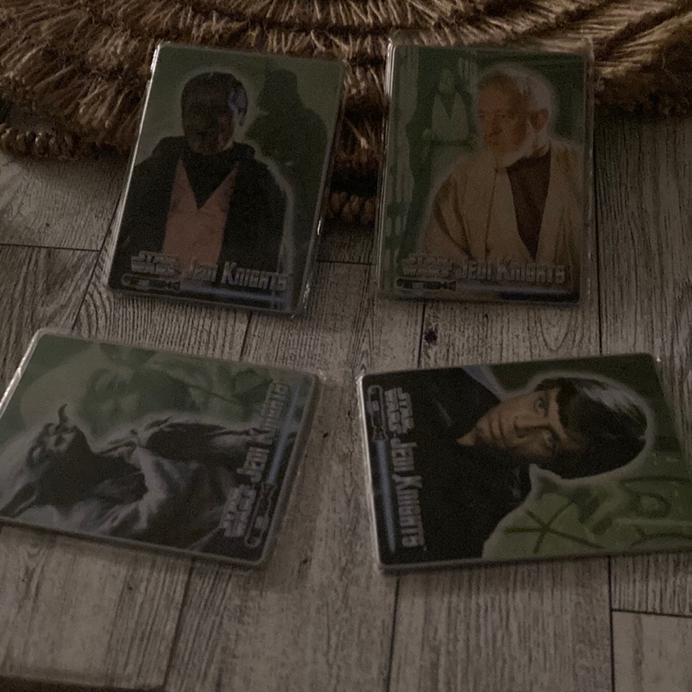 Set of 4 collectible Star Wars cards.
